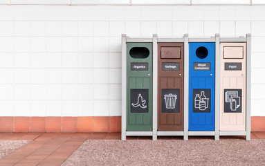 Public garbage and recycling bin.  All-in-one container to collect organics, garbage, mixed containers and paper.  