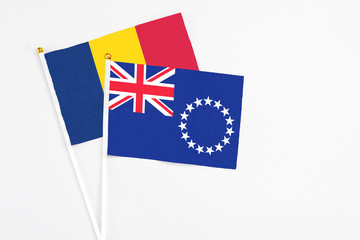 Cook Islands and Chad stick flags on white background. High quality fabric, miniature national...