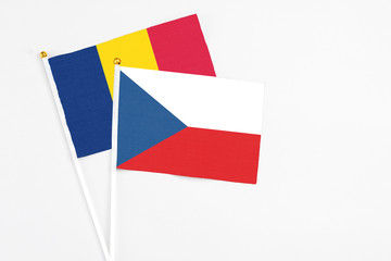 Czech Republic and Chad stick flags on white background. High quality fabric, miniature national flag. Peaceful global concept.White floor for copy space.