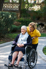 Fototapeta na wymiar Careful caregiver taking care of the patient, outdoors.