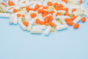 pills and tablets on blue background