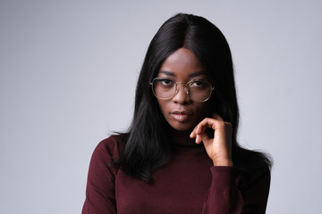 Confident african model looking very intelligent in eyeglasses.