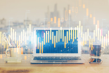 Forex Chart hologram on table with computer background. Multi exposure. Concept of financial markets.