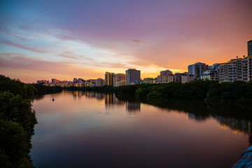 Sanya Cityscape with Sanya River View and Apartment Buildings in the sunset time, Hainan Province, China