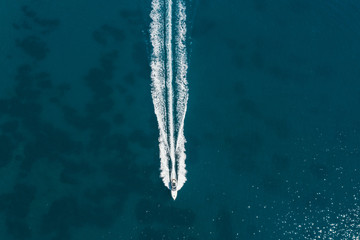 Aerial view of small boat flowing in sea, travel and vacation concept