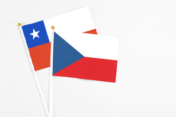 Czech Republic and Chile stick flags on white background. High quality fabric, miniature national flag. Peaceful global concept.White floor for copy space.
