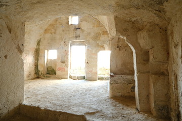 Sassi of Matera with arched ceilings and vaults. Doors and windows in an ancient underground house...