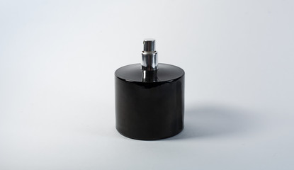 black bottle of perfume isolated on white background