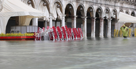venice Chairs of a pub in Saint Mark Square during the flood