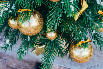 Christmas background. Green fir tree with golden balls and gift boxes. - 302507896
