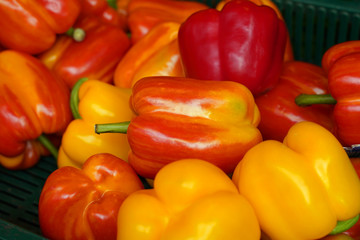 red and yellow peppers at the market