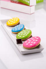 easter cookies in different shapes and colored