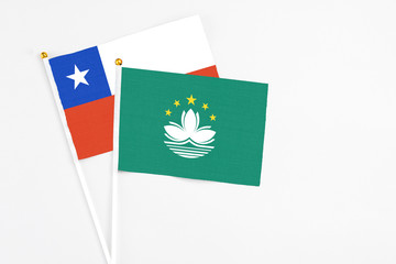 Macao and Chile stick flags on white background. High quality fabric, miniature national flag. Peaceful global concept.White floor for copy space.