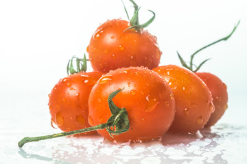 fresh organic cherry tomatoes on white background