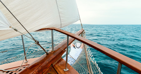 Fototapeta premium man resting or sleeping on the yacht, summer vacation