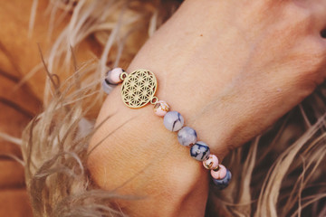 Fashionable boho yoga mineral stone bracelet on female wrist
