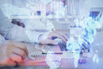 Multi exposure of stock market chart with man working on computer on background. Concept of financial analysis.