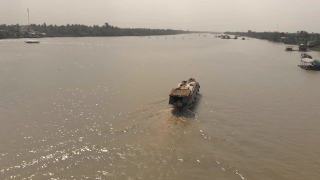 Mekong Delta river with floating boat, drone, Vietnam