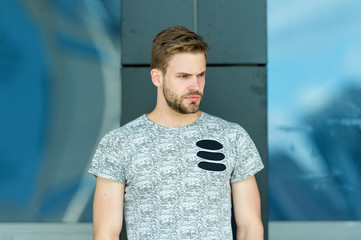 modern life. macho man glass building background. male fashion summer trends. strong-willed male....