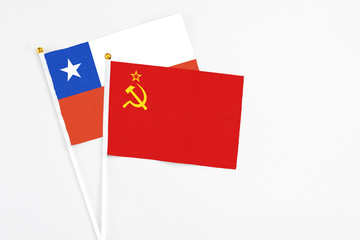 Soviet Union and Chile stick flags on white background. High quality fabric, miniature national flag. Peaceful global concept.White floor for copy space.