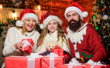 Taking advantages of Christmas sales. Happy family celebrate new year. xmas gift boxes. Open...