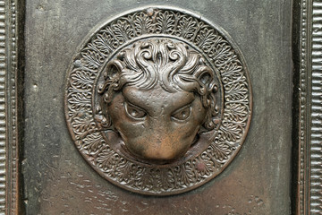 Very old metal ornament on the door from the Middle Ages