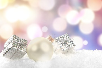 Fototapeta na wymiar Silver shiny christmas balls in snow