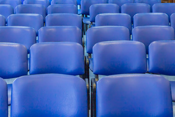 Blue empty seats in the audience prepared for the participants of the conference or presentation. Organization and holding of mass events.