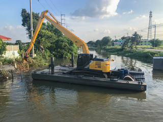BackHoe Excavator Machine digging canal at Thailand