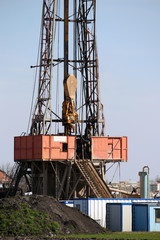 Fototapeta na wymiar Oil and gas drilling rig with workers