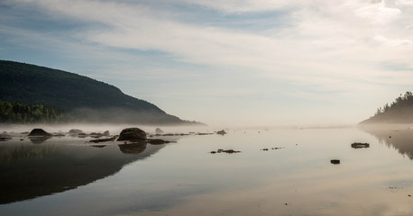 bay with rocks and mist