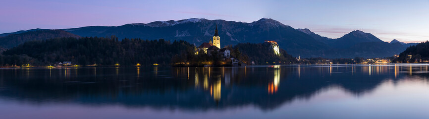Panorama of lake Bled and Pilgrimage Church of the Assumption of Maria with reflection in the water...