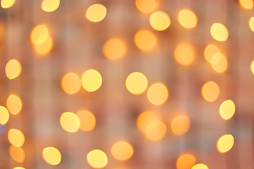 Obraz premium Golden beautiful blurred bokeh background with copy space.