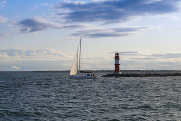 A sailing boat leaving the harbour in Warnem&uuml;nde