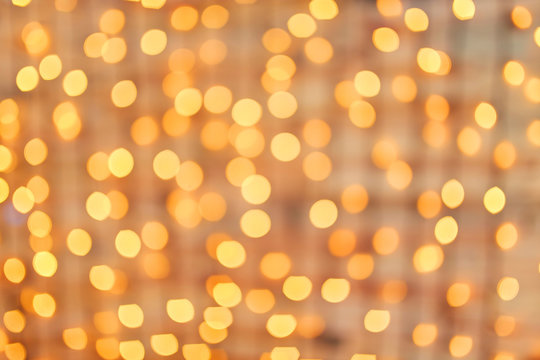 Square background bokeh of sparkling golden festive lights