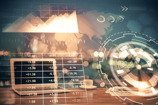 Financial graph colorful drawing and table with computer on background. Multi exposure. Concept of international markets.