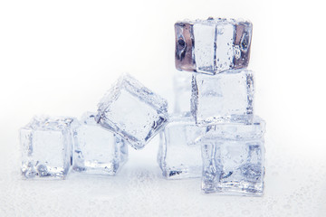 Ice cubes square with drops water clean on white background