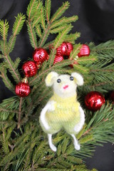 One knitted mouse toys with fir branches and balls