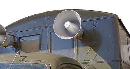 Megaphone on old car on a white