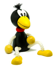 Toy, wooden crow on a white background.