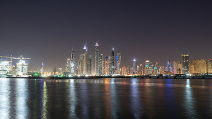 Fototapeta na wymiar Dubai city skyline at night showing JBR 