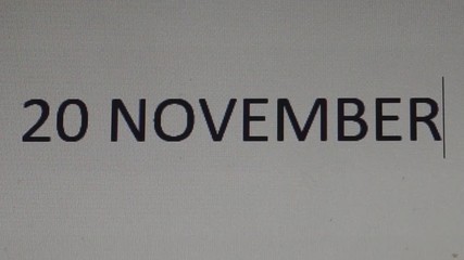 the date November 20 is typed on the monitor screen in a text editor