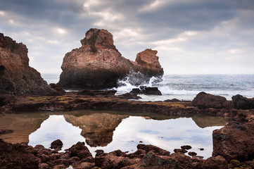 Rocks on the shore of Atlantic ocean in Algarve region in south Portugal.
