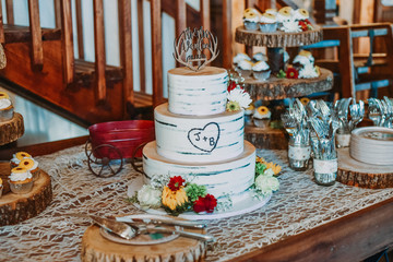 wedding cake and a set of vintage looking wedding kitchen utensils