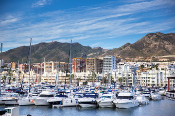 Fototapeta na wymiar Panoramic view over the Marina Benalmadena bay . Boats docked for the end of sailing season 
