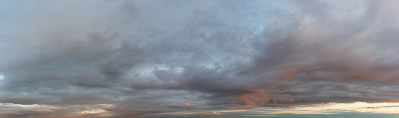 Fototapeta na wymiar Fantastic dark thunderclouds, natural sky composition - wide panorama