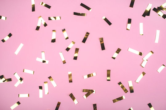 Gold Confetti On Pink Background. Flat Lay, Top View.