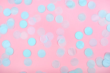 Mint confetti on pink background. Flat lay, top view.