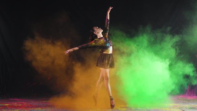 Ballet dance performance with colour powder blast slow motion action clip