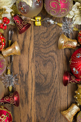 Christmas decoration ornament, new year toys of red and gold colors on wooden background, winter holidays and celebrations concept